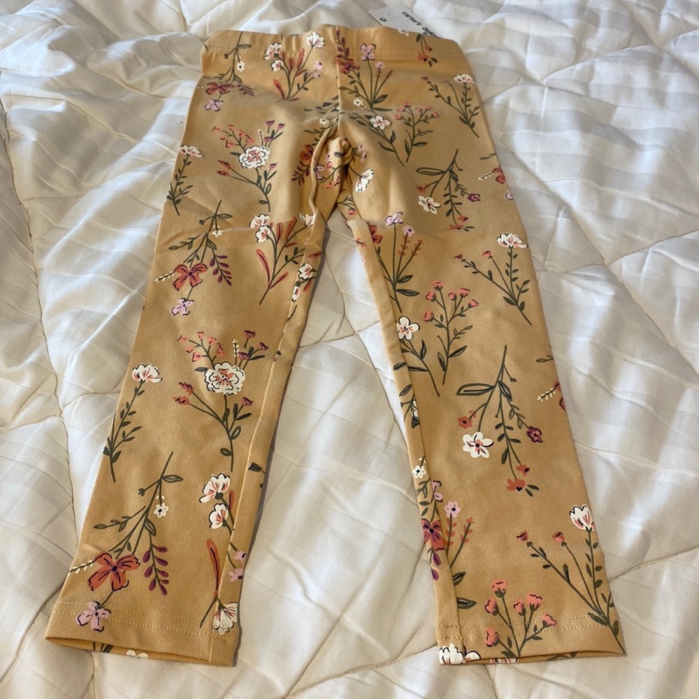 Carters mustard colored leggings with flowers.